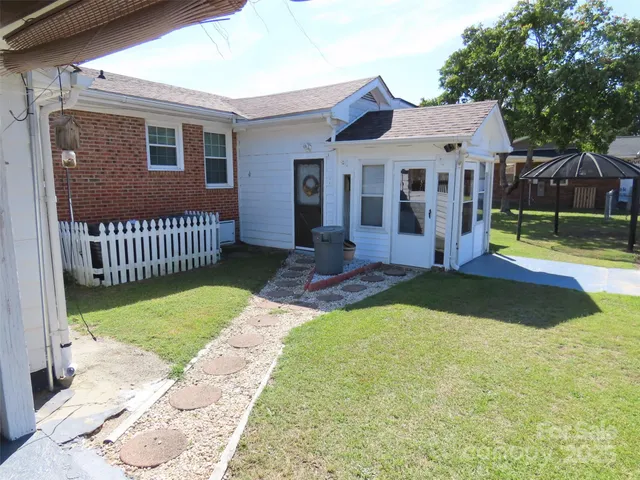 a front view of a house with a yard table and slide