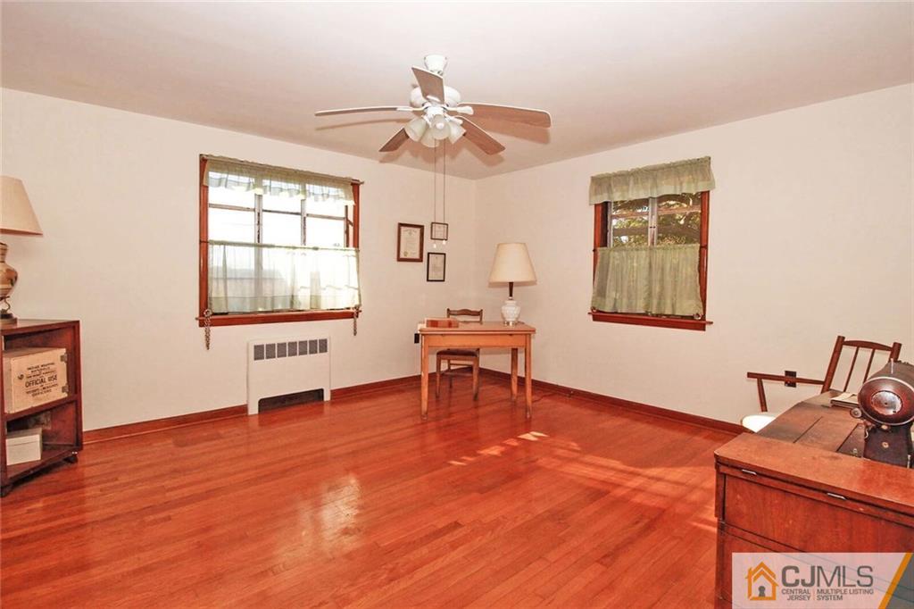 219 Lambertson Road Old Bridge, NJ 07747 - Photo 11 of 21 a living room with furniture and a wooden floor