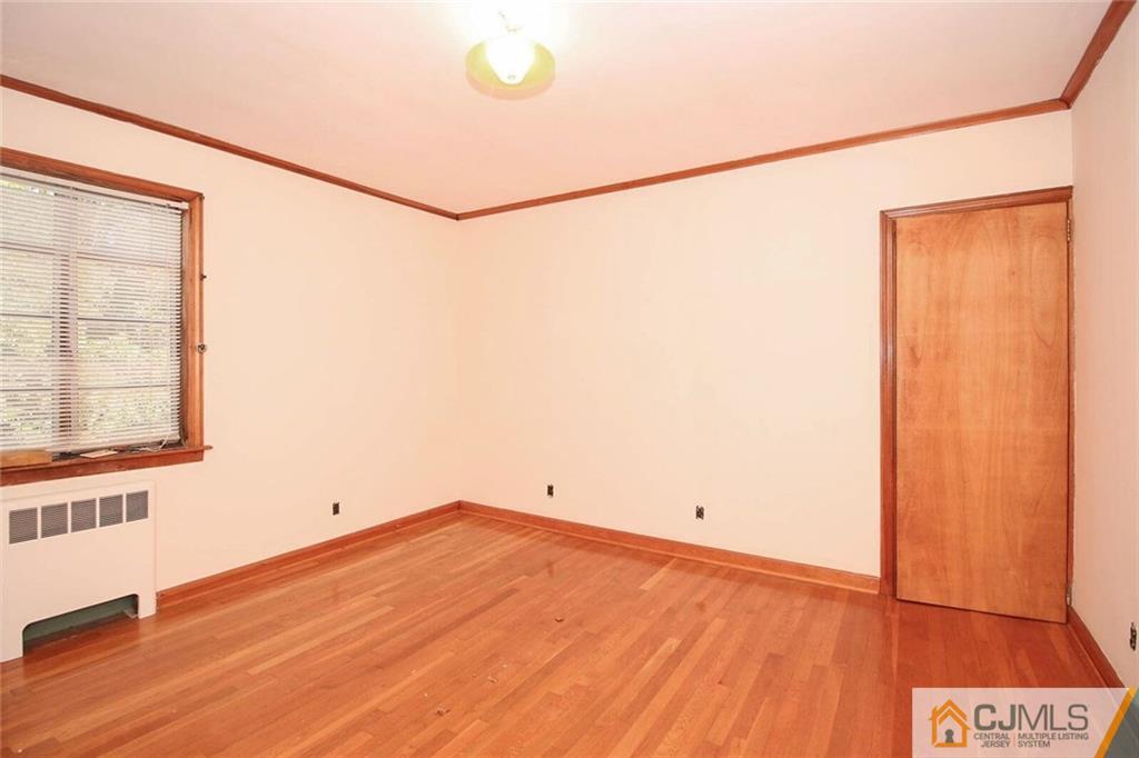 219 Lambertson Road Old Bridge, NJ 07747 - Photo 12 of 21 a view of a room with window and wooden floor