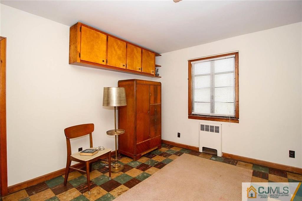 219 Lambertson Road Old Bridge, NJ 07747 - Photo 14 of 21 a bedroom with a bed and a window