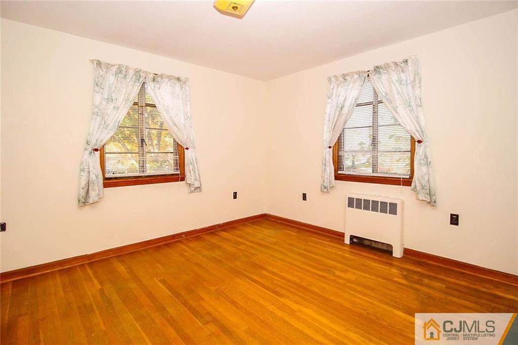 219 Lambertson Road Old Bridge, NJ 07747 - Photo 15 of 21 a view of a room with wooden floor and windows