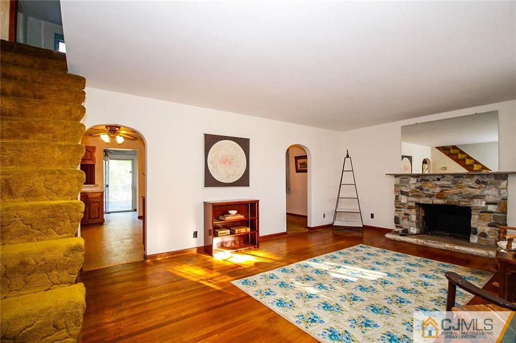 219 Lambertson Road Old Bridge, NJ 07747 - Photo 3 of 21 a living room with furniture and a fireplace