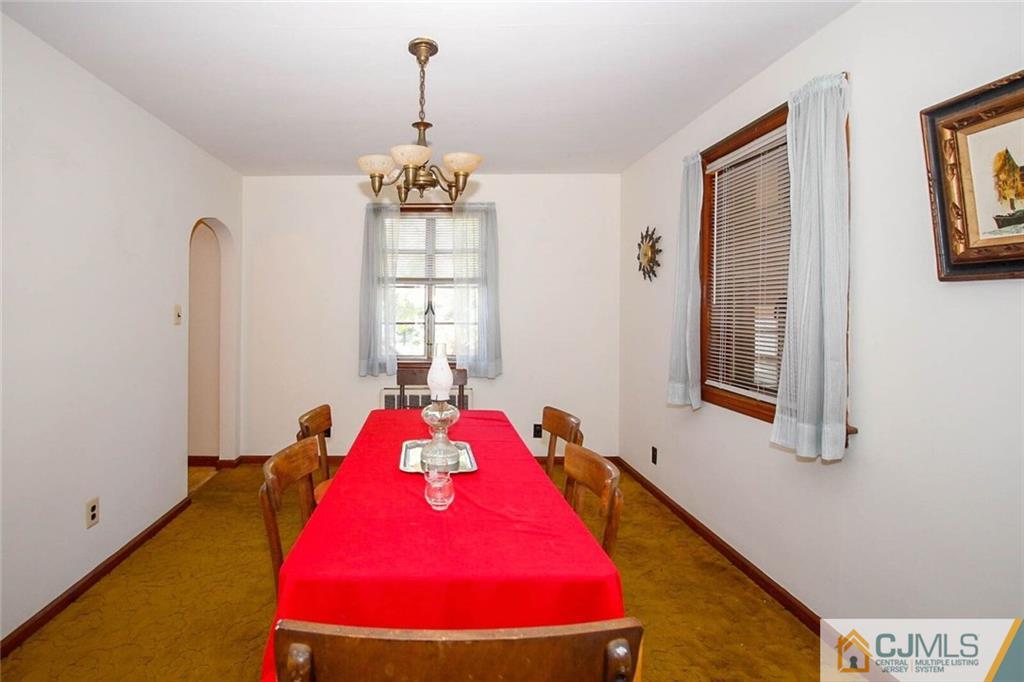 219 Lambertson Road Old Bridge, NJ 07747 - Photo 5 of 21 a bedroom with a bed and a chandelier