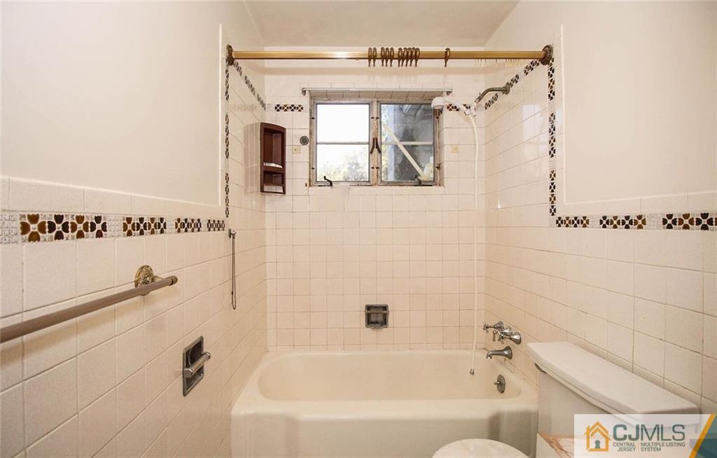 219 Lambertson Road Old Bridge, NJ 07747 - Photo 10 of 21 a bathroom with a bathtub a toilet and a shower