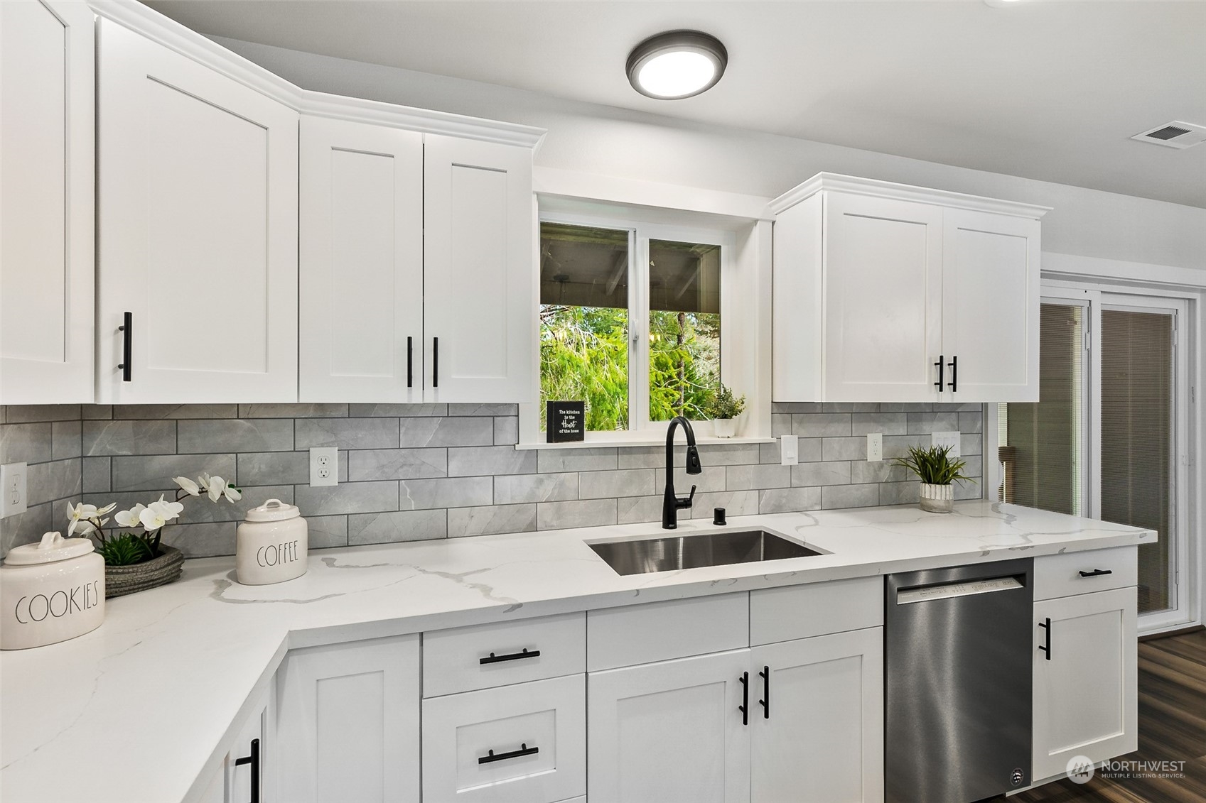 1808 Chilton Road Aberdeen, WA 98520 - Photo 5 of 20 a kitchen with stainless steel appliances white cabinets and a sink