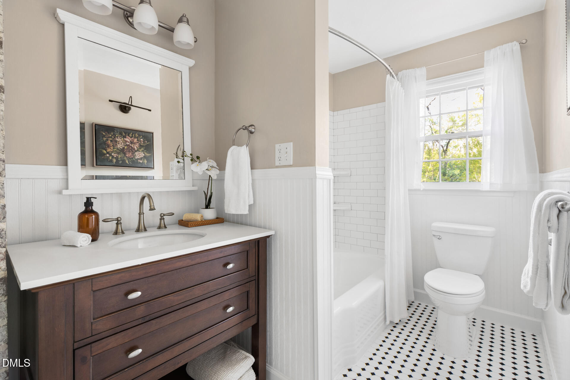 1414 Acadia Street Durham, NC 27701 - Photo 23 of 46 a bathroom with a sink a toilet and a mirror