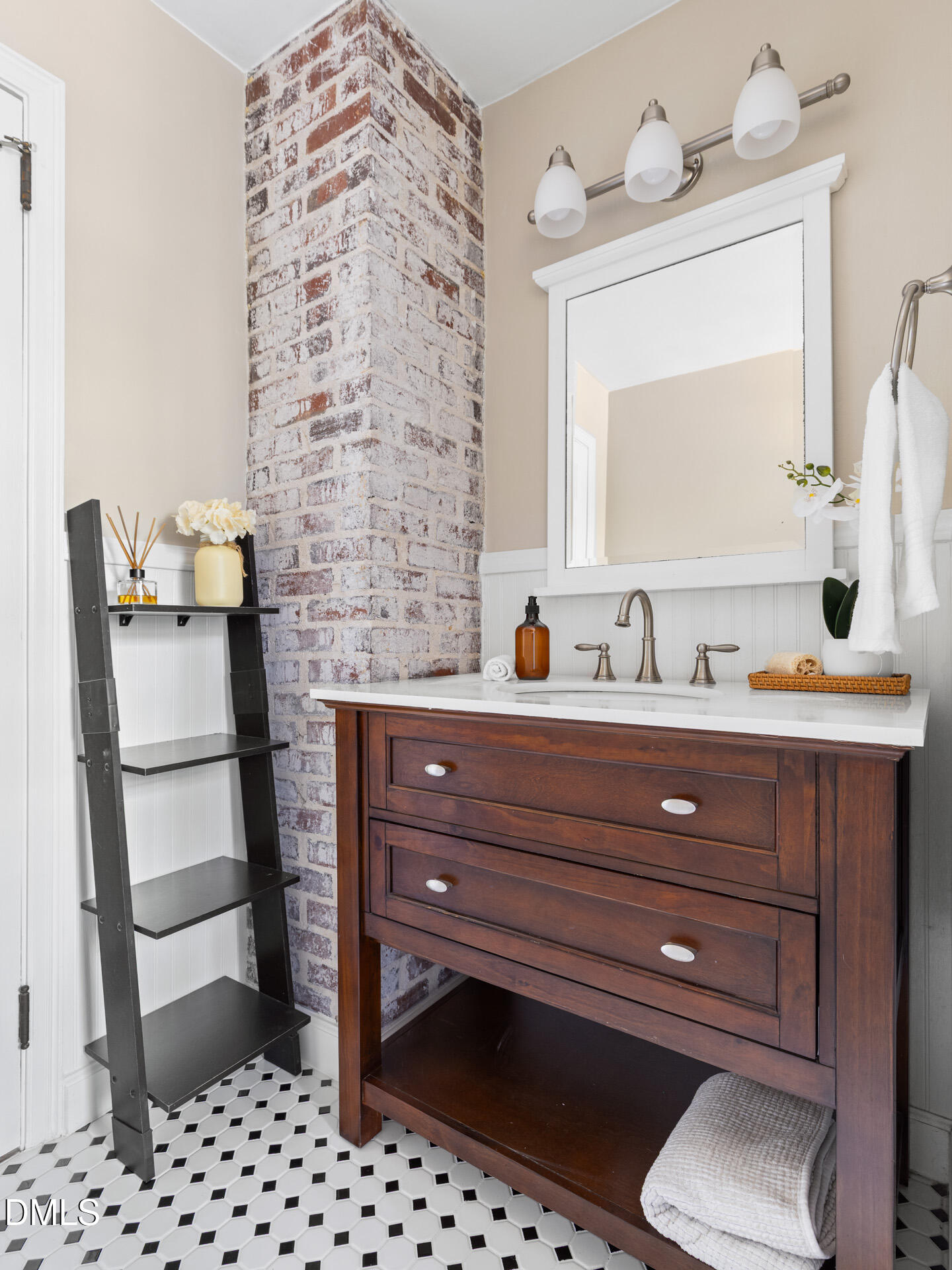 1414 Acadia Street Durham, NC 27701 - Photo 24 of 46 a bathroom with a sink and a mirror