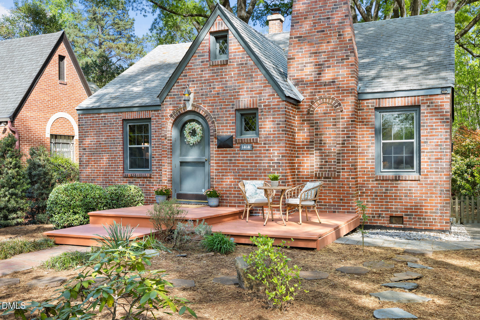 1414 Acadia Street Durham, NC 27701 - Photo 3 of 46 a front view of a house with garden