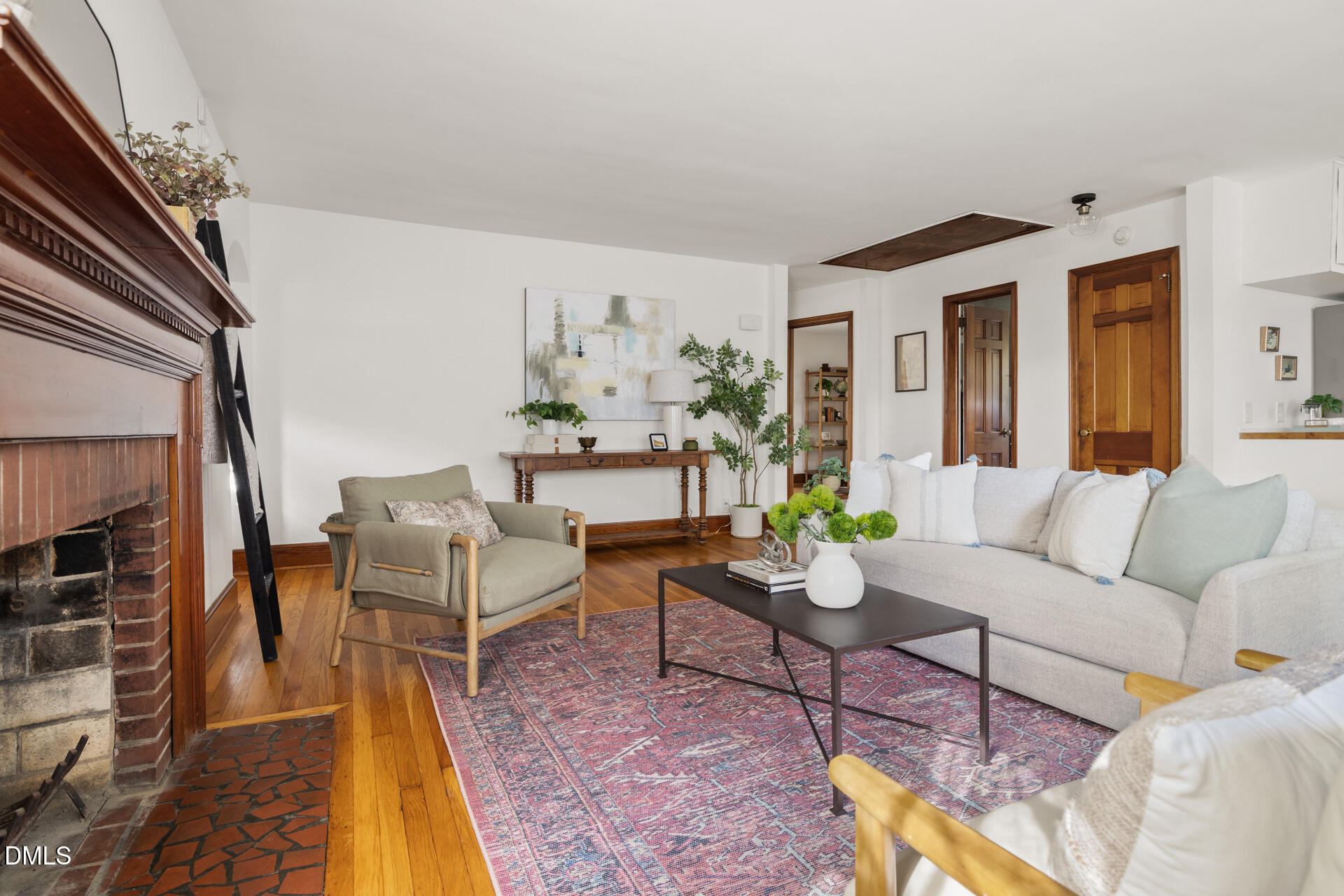 1414 Acadia Street Durham, NC 27701 - Photo 9 of 46 a living room with furniture and a fireplace