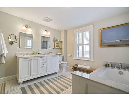 27 Pearl Street Marblehead, MA 01945 - Photo 14 of 25 a bathroom with a sink double vanity granite and a mirror