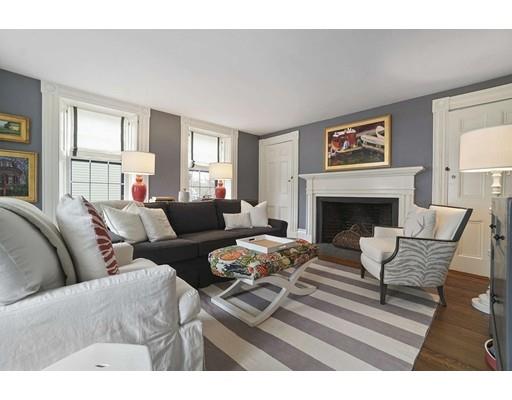 27 Pearl Street Marblehead, MA 01945 - Photo 15 of 25 a living room with furniture a fireplace and a large window