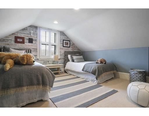 27 Pearl Street Marblehead, MA 01945 - Photo 16 of 25 a bedroom with a large bed and a large window