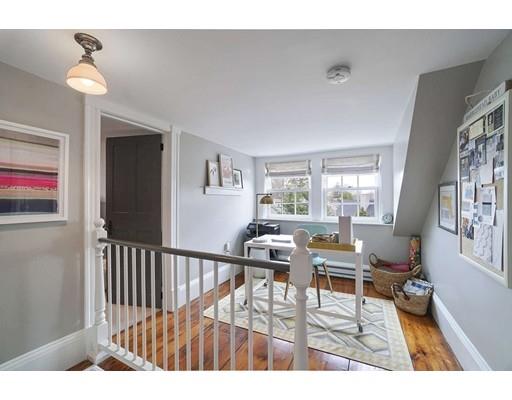 27 Pearl Street Marblehead, MA 01945 - Photo 17 of 25 a living room with furniture and a window