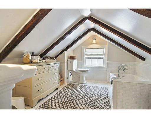 27 Pearl Street Marblehead, MA 01945 - Photo 20 of 25 a bathroom with a sink a toilet and a window