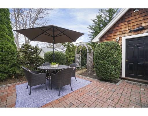 27 Pearl Street Marblehead, MA 01945 - Photo 21 of 25 a view of backyard with outdoor seating and trees