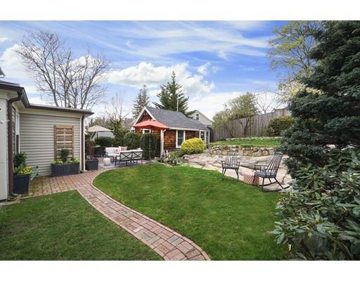 27 Pearl Street Marblehead, MA 01945 - Photo 22 of 25 a backyard of a house with table and chairs