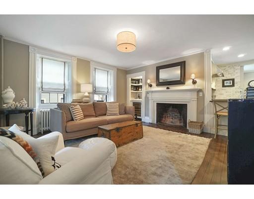27 Pearl Street Marblehead, MA 01945 - Photo 5 of 25 a living room with furniture a fireplace and a window
