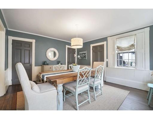 27 Pearl Street Marblehead, MA 01945 - Photo 7 of 25 a view of a dining room with furniture and chandelier