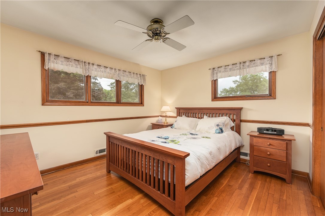 4712 Hillside Road Independence, OH 44131 - Photo 22 of 47 Bedroom with light wood finished floors and a ceiling fan