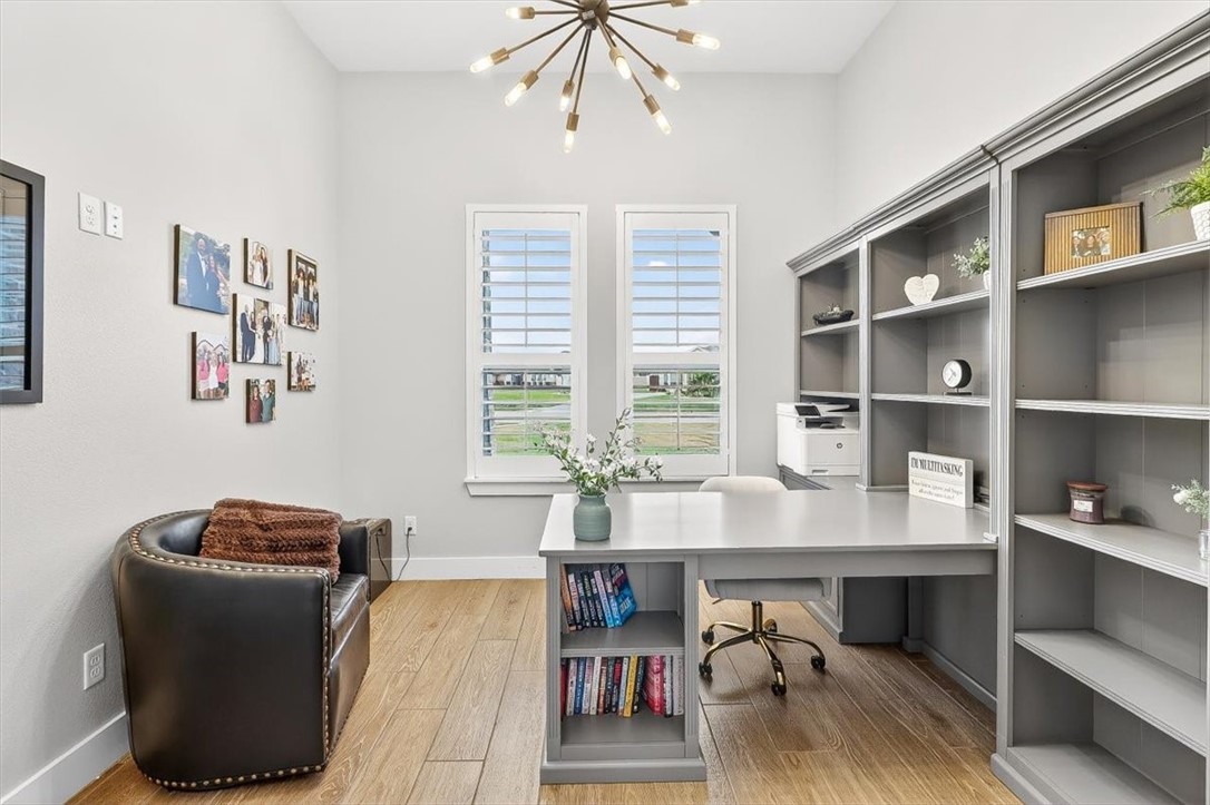 8738 KIng Ranch Drive Corpus Christi, TX 78414 - Photo 17 of 40 a view of a workspace with furniture and a window