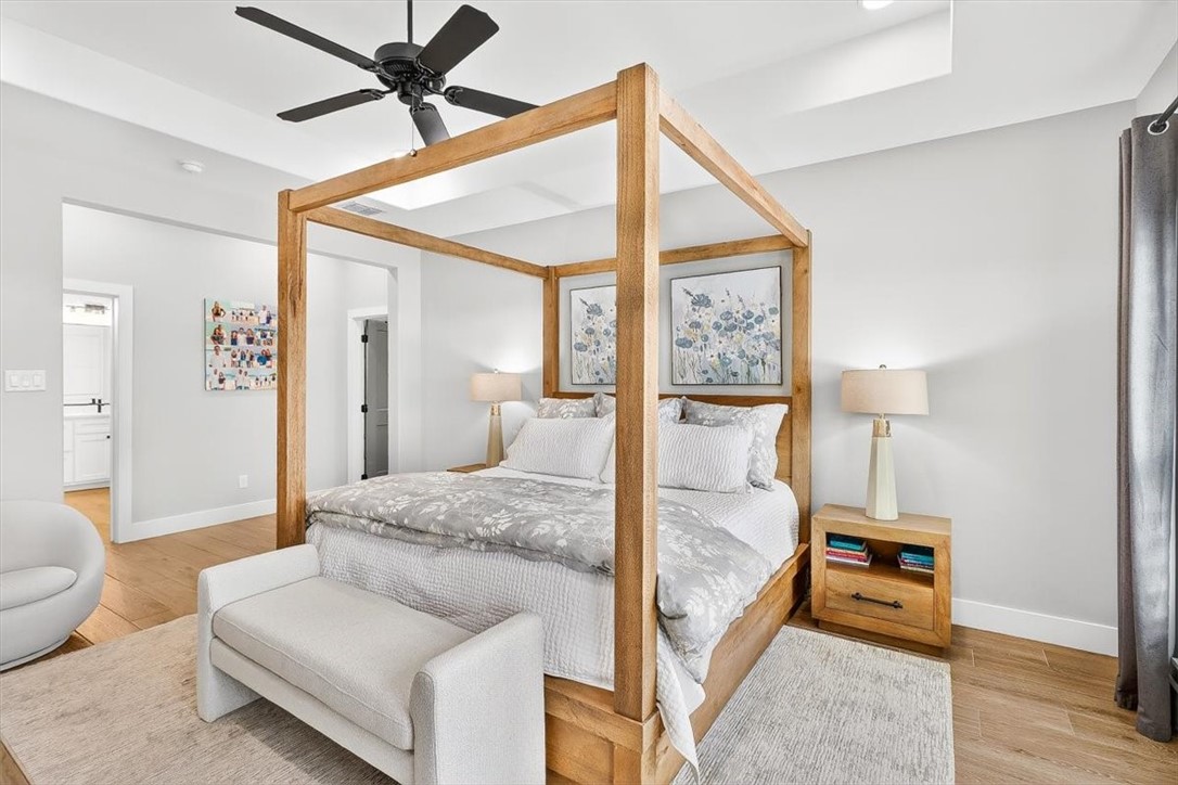 8738 KIng Ranch Drive Corpus Christi, TX 78414 - Photo 18 of 40 a bedroom with a bed and a lamp