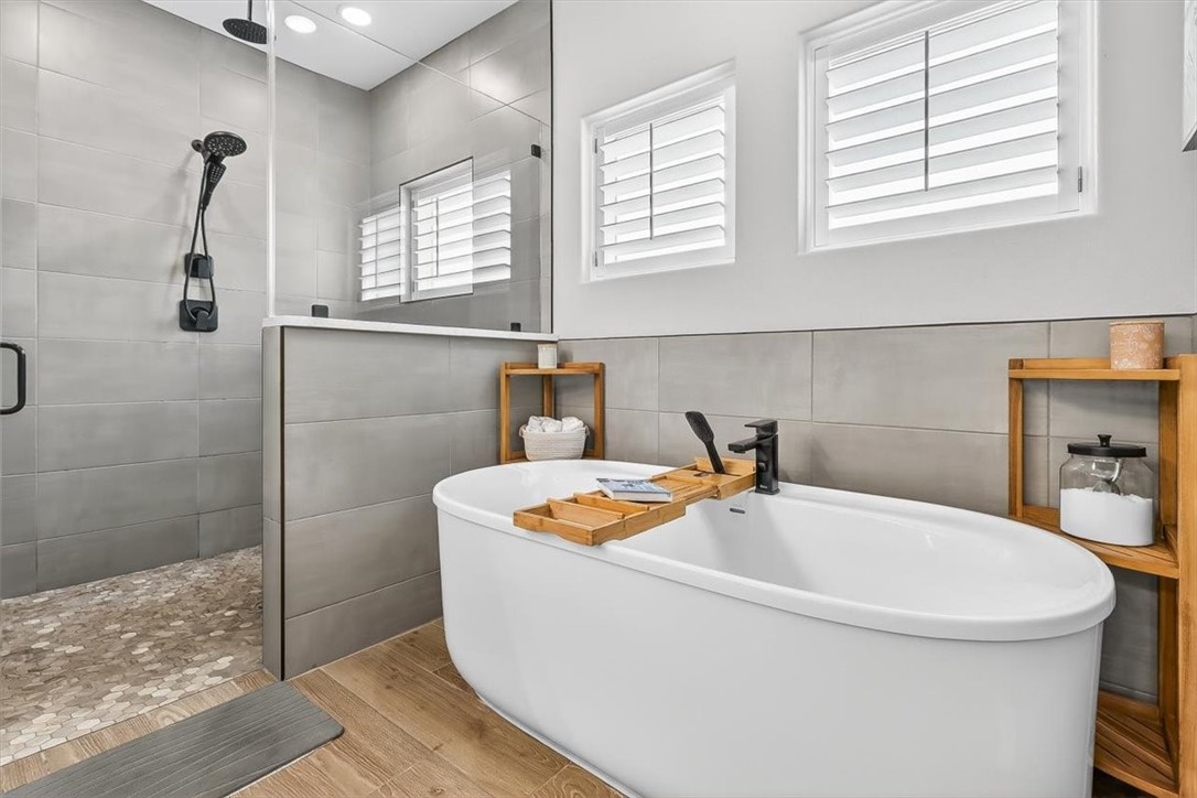 8738 KIng Ranch Drive Corpus Christi, TX 78414 - Photo 21 of 40 a bathroom with a sink a window and a shower