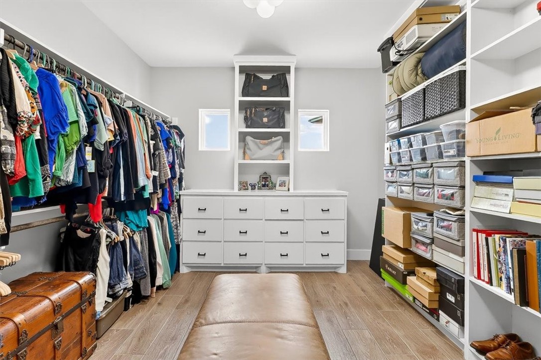 8738 KIng Ranch Drive Corpus Christi, TX 78414 - Photo 22 of 40 a view of walk in closet with clothes and shoes