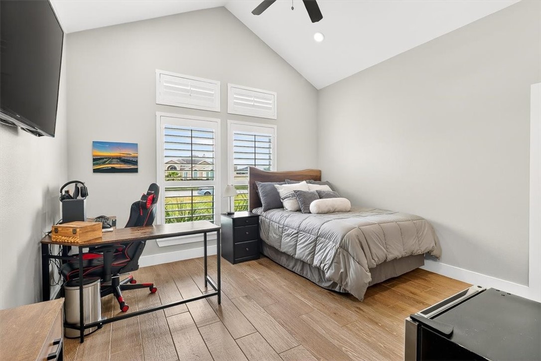 8738 KIng Ranch Drive Corpus Christi, TX 78414 - Photo 23 of 40 a bedroom with a bed and a flat screen tv
