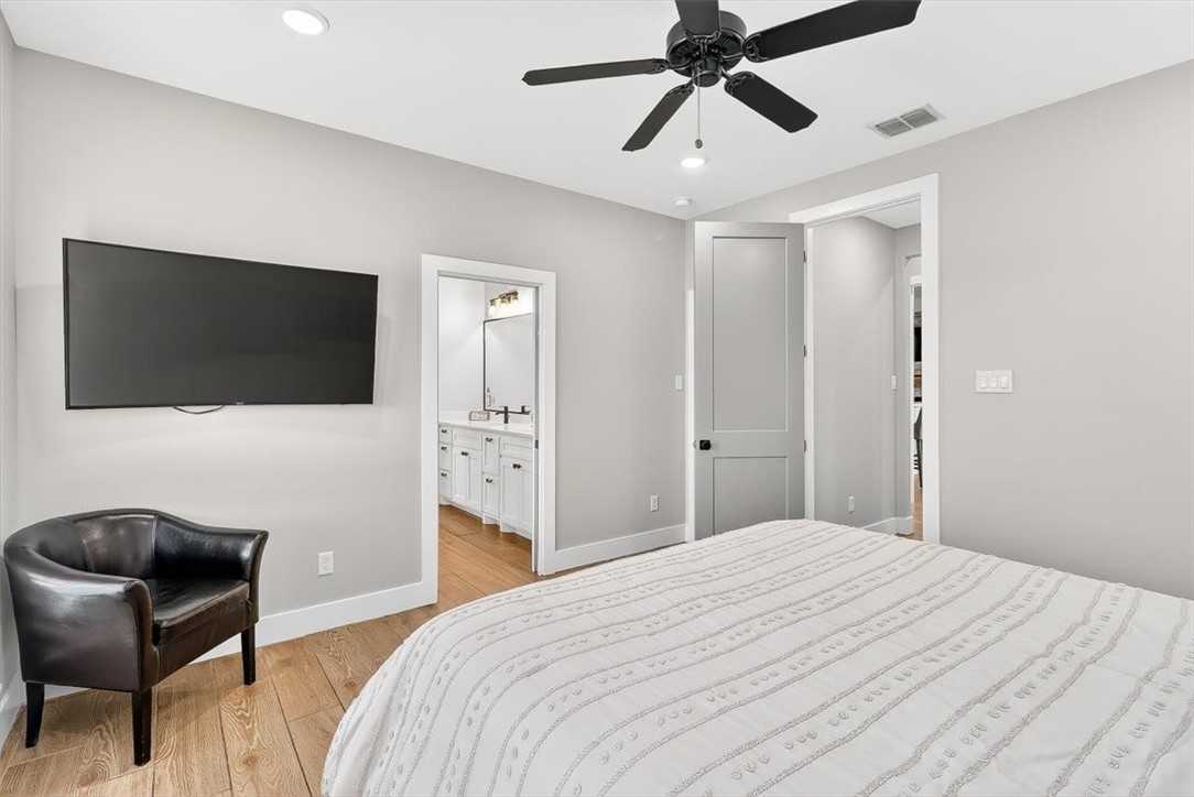 8738 KIng Ranch Drive Corpus Christi, TX 78414 - Photo 27 of 40 a bedroom with a bed and a flat screen tv