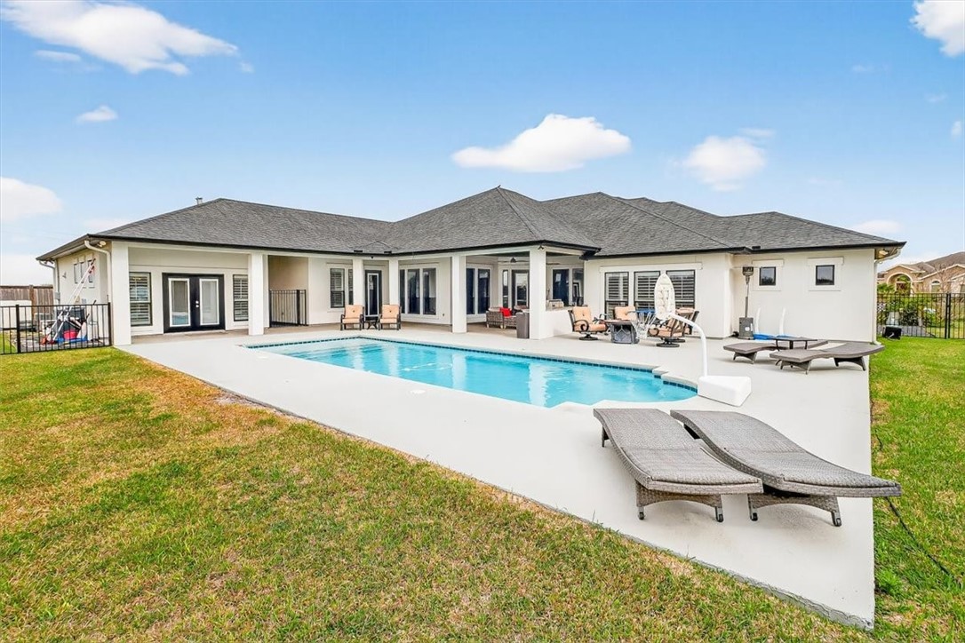 8738 KIng Ranch Drive Corpus Christi, TX 78414 - Photo 38 of 40 a swimming pool view with a outdoor seating