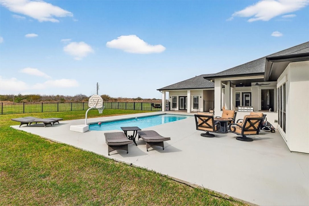 8738 KIng Ranch Drive Corpus Christi, TX 78414 - Photo 39 of 40 a view of a house with swimming pool and sitting area