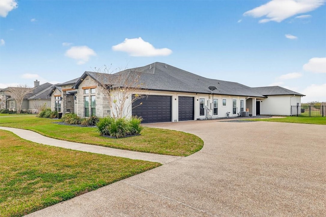 8738 KIng Ranch Drive Corpus Christi, TX 78414 - Photo 40 of 40 a front view of a house with a yard