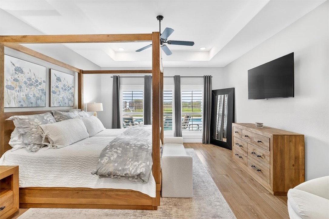 8738 KIng Ranch Drive Corpus Christi, TX 78414 - Photo 6 of 40 a spacious bedroom with a large bed and a flat screen tv