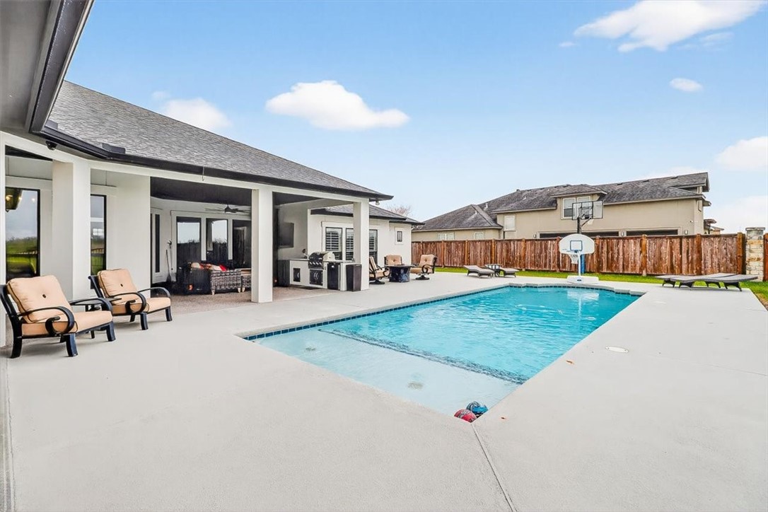 8738 KIng Ranch Drive Corpus Christi, TX 78414 - Photo 9 of 40 a view of a backyard with a patio