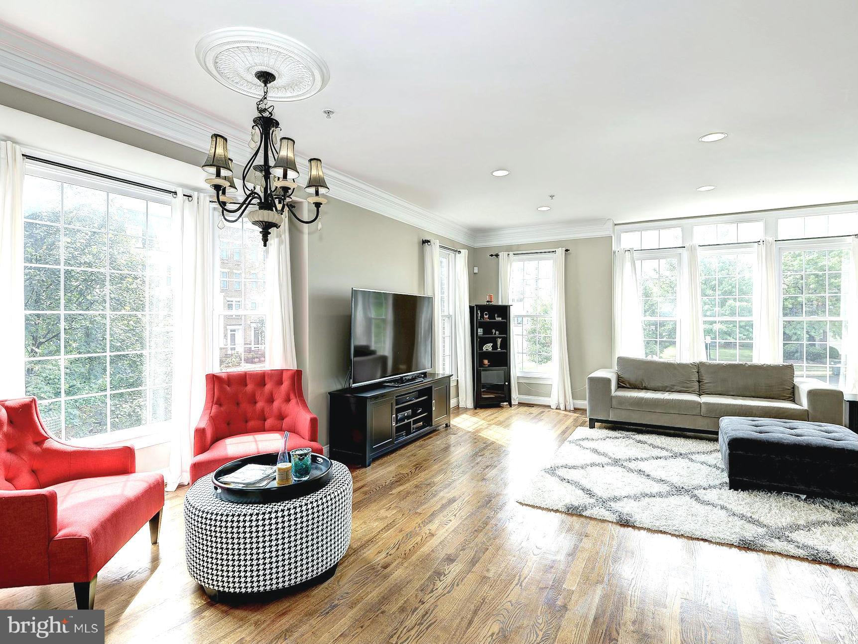 11400 Log Ridge Drive Fairfax, VA 22030 - Photo 3 of 30 a living room with furniture a flat screen tv and a large window
