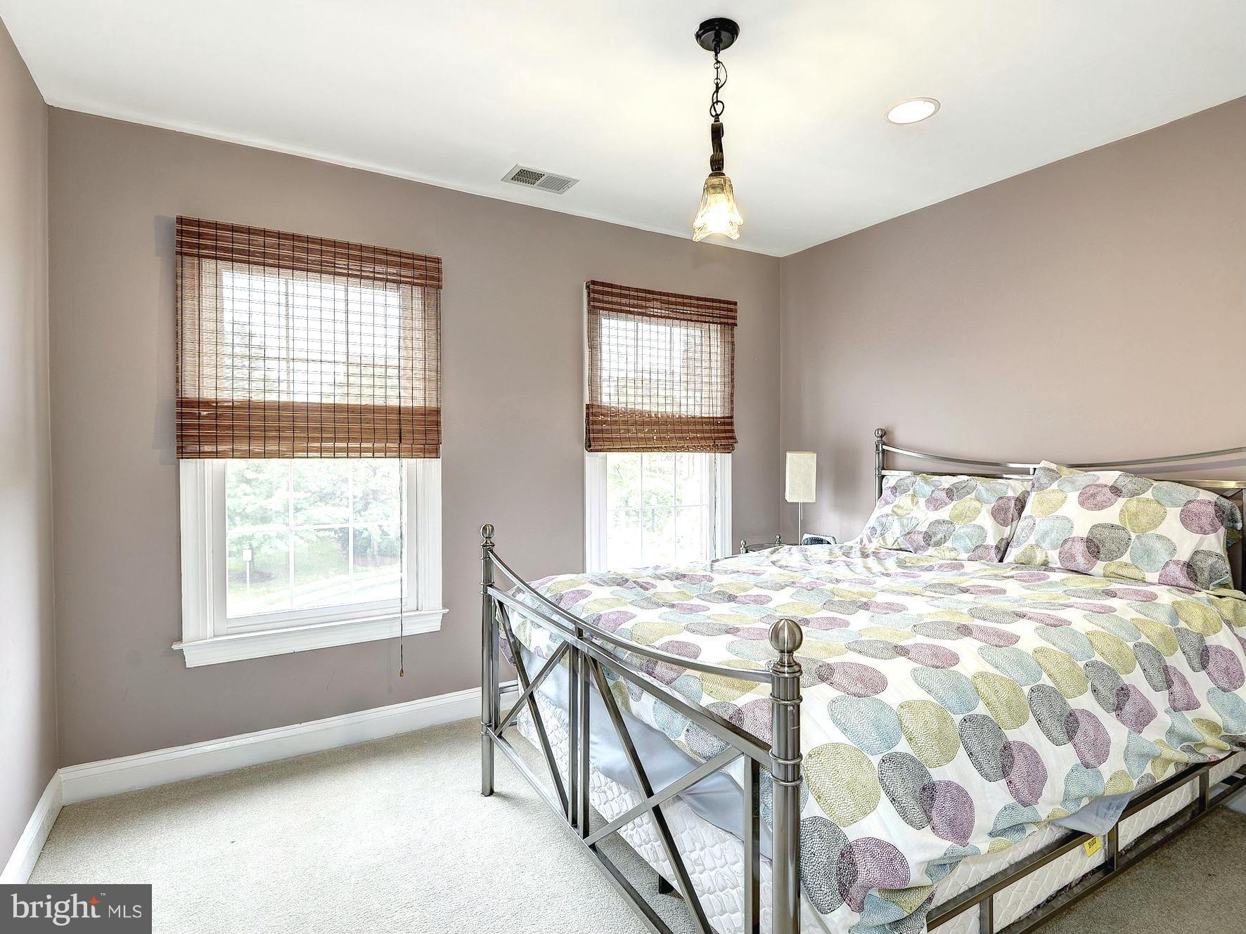 11400 Log Ridge Drive Fairfax, VA 22030 - Photo 23 of 30 a bedroom with a bed and a window