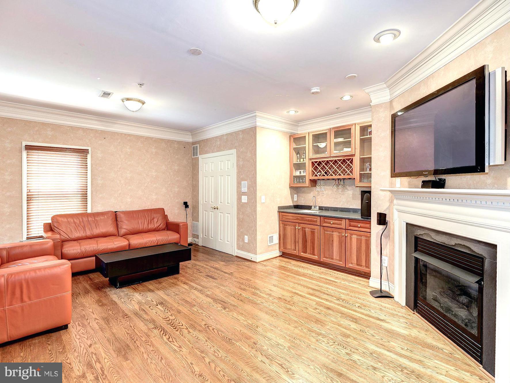 11400 Log Ridge Drive Fairfax, VA 22030 - Photo 8 of 30 a living room with furniture and a flat screen tv