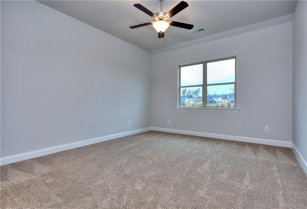 130 Classic Overlook Homer, GA 30547 - Photo 24 of 43 an empty room with a window and a fan