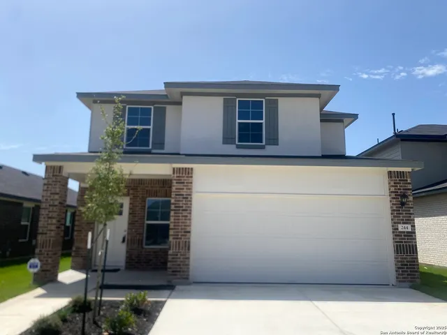 a view of house with outdoor space