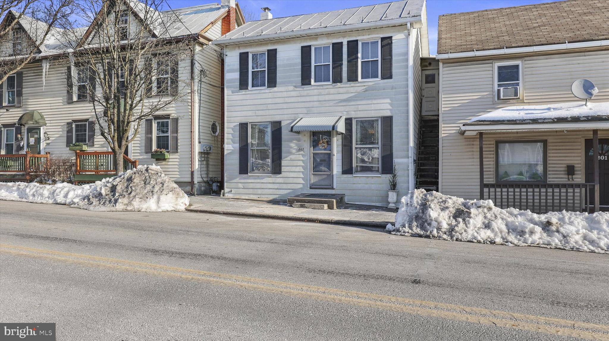 a front view of a house with a large windows