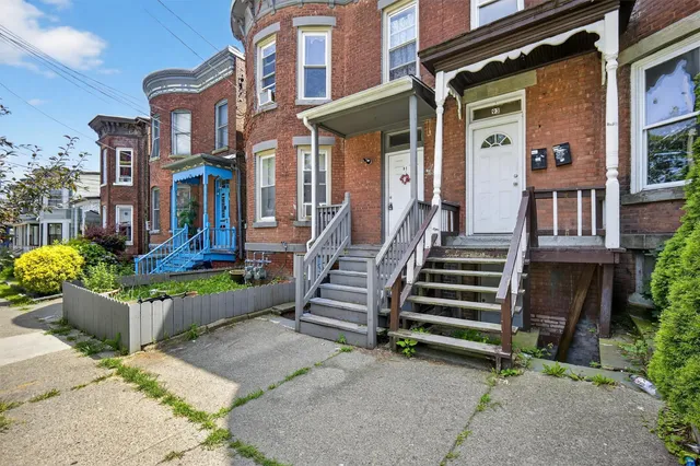 front view of a house with a small yard