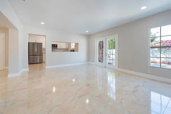 a view of a kitchen with a sink and a window