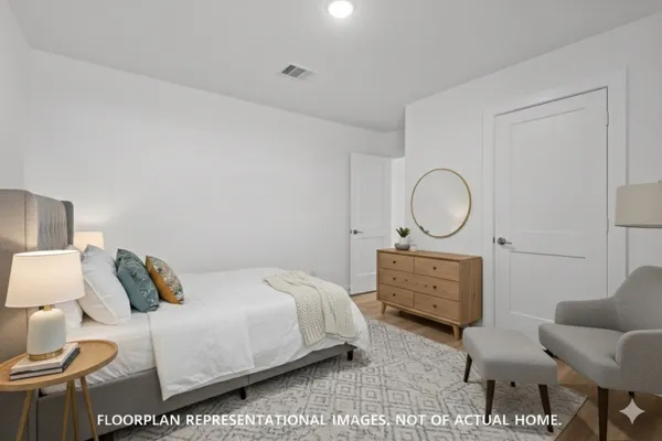 a living room with furniture kitchen view and a potted plant