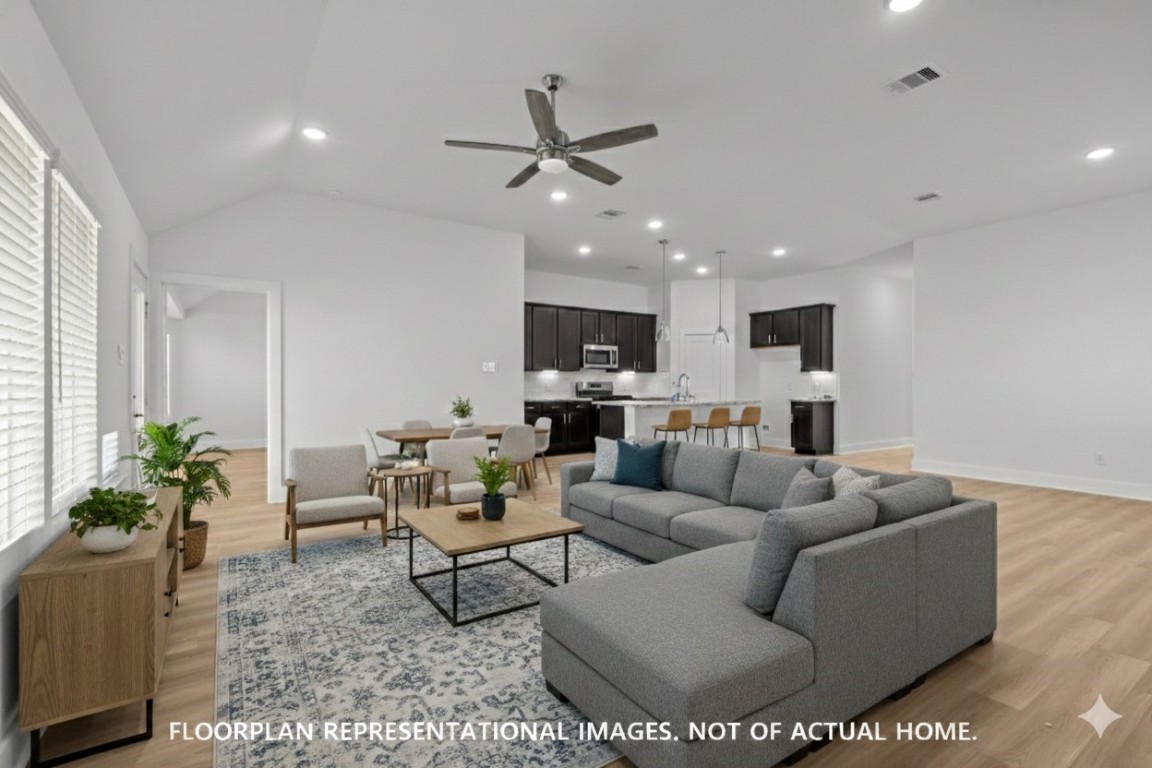 1815 Sleeping Hls Drive Rosenberg, TX 77471 - Photo 12 of 12 a living room with furniture kitchen view and a potted plant