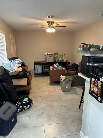 a room with furniture and a flat screen tv