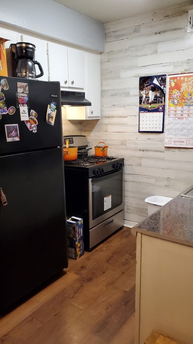 2922 Randolph Road Pasadena, TX 77503 - Photo 19 of 50 a kitchen with stainless steel appliances granite countertop a refrigerator and a stove