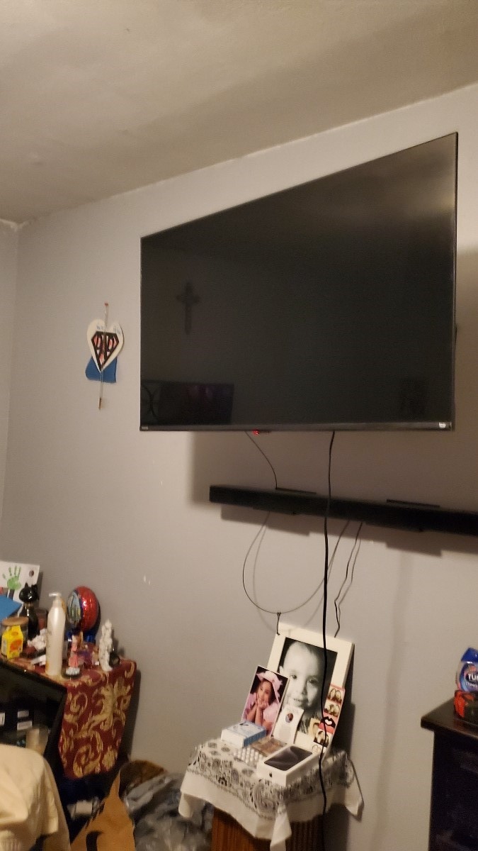 2922 Randolph Road Pasadena, TX 77503 - Photo 26 of 50 a living room with furniture and a flat screen tv