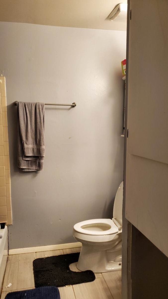 2922 Randolph Road Pasadena, TX 77503 - Photo 27 of 50 a white toilet sitting next to a shower