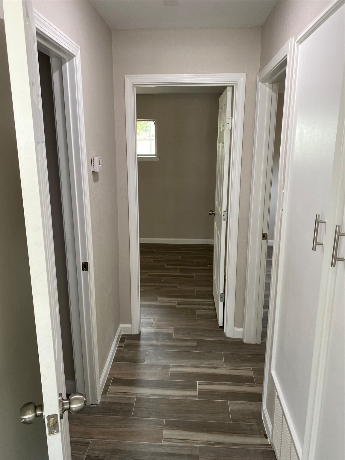 2922 Randolph Road Pasadena, TX 77503 - Photo 32 of 50 a view of a hallway with wooden floor and staircase