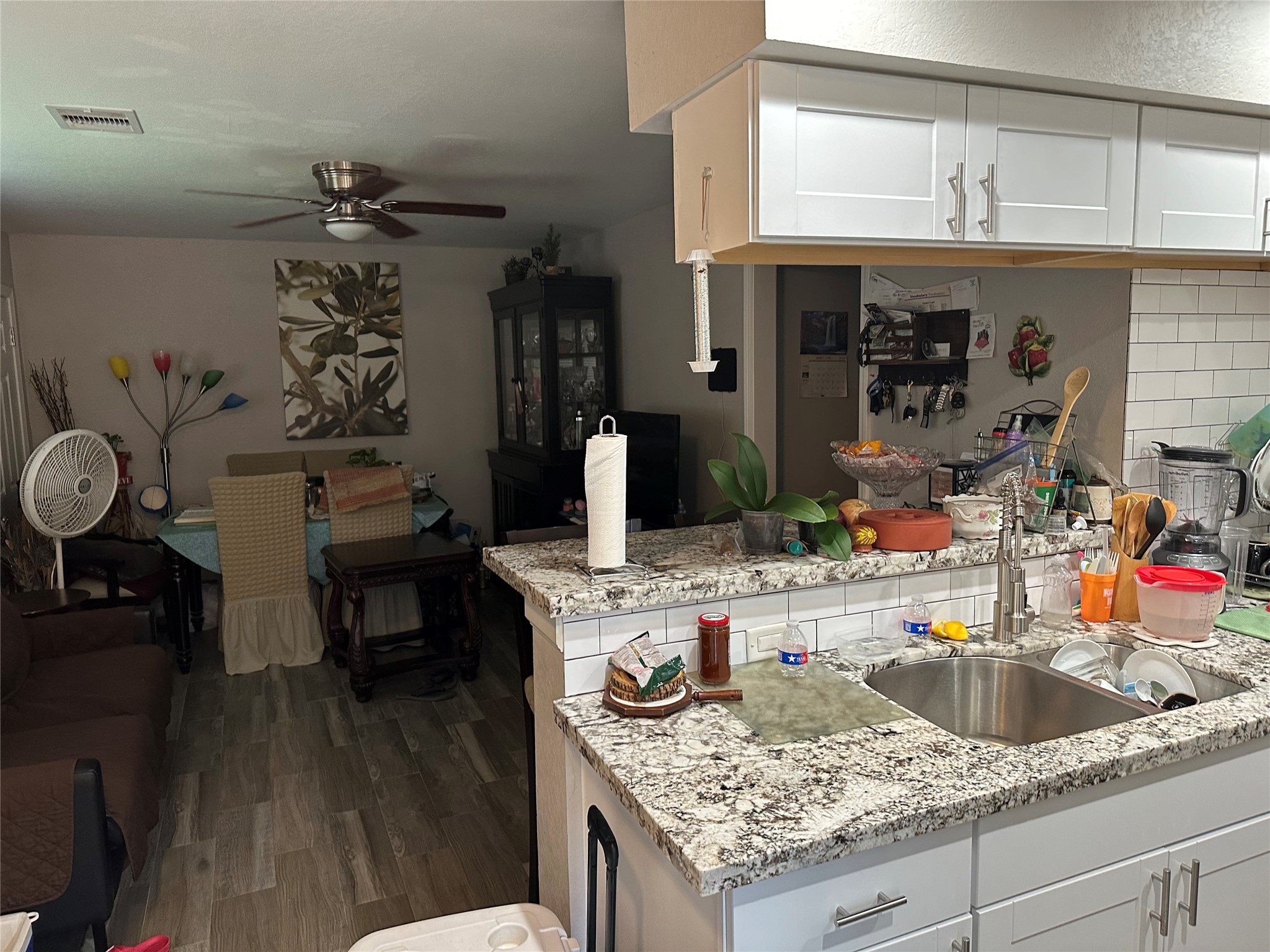 2922 Randolph Road Pasadena, TX 77503 - Photo 40 of 50 a view of a kitchen area with furniture and wooden floor